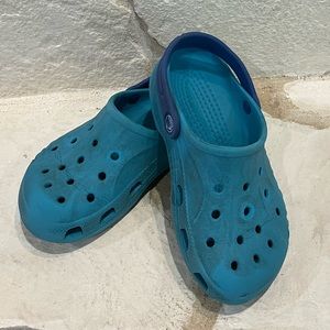 Turquoise and blue crocs